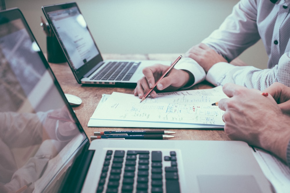 Financial planning documents and laptops